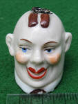Man with fly on head porcelain sewing tape measure