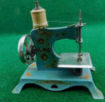 Casige Turquoise Blue TSM / Toy Sewing Machine w/ Sunflower Decorations