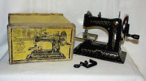 Bing 
	Werke Cast Iron Sewing Machine in the Box