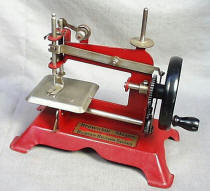 Buster 
	Brown Shoes Advertising Toy Sewing Machine